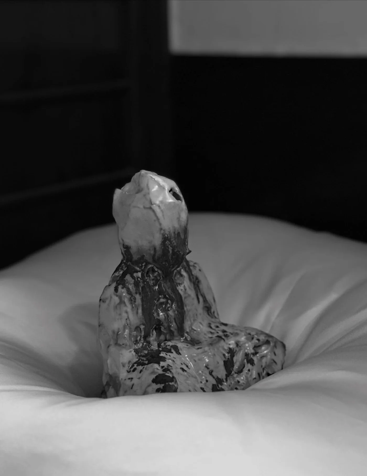Iron-glazed Buddha by Oza Craft, a contemporary potter